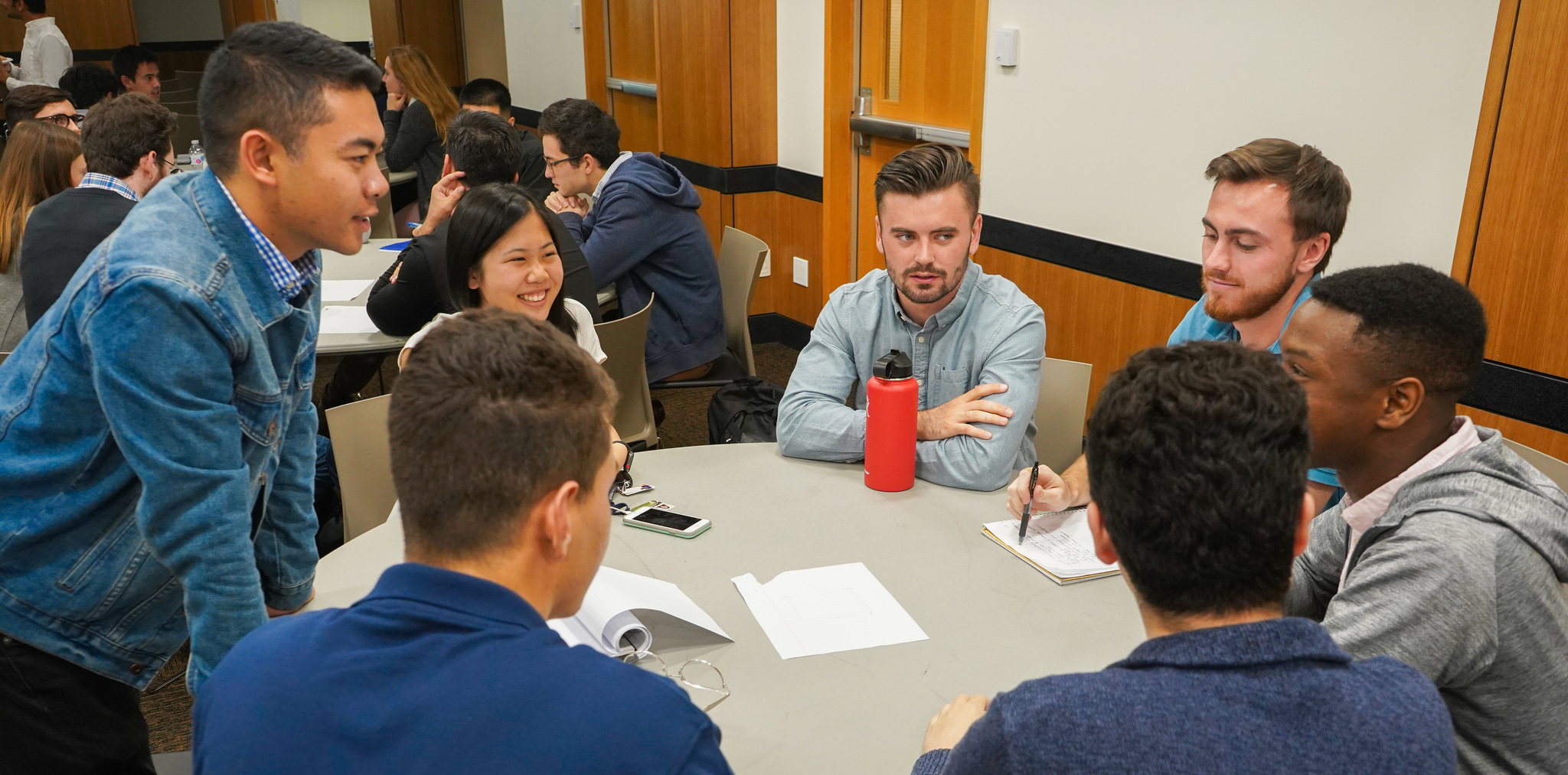 Students collaborating at a table.